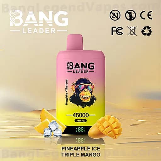Pink BANG LEADER vape bottle with a cartoon monkey wearing sunglasses on the label, set on a reflective surface with pineapple chunks and ice, highlighting 45,000 puffs and the Pineapple Ice Triple Mango flavor.