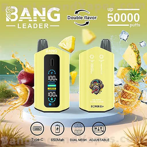 Two yellow BANG Leader vape pod devices on a white pedestal against a tropical fruit background; the left unit shows a blue digital readout and the right displays a mascot logo, with Double flavor and up to 50,000 puffs text above, and icons below indicating Type-C charging, 650mAh capacity, dual mesh coils, and adjustable wattage.